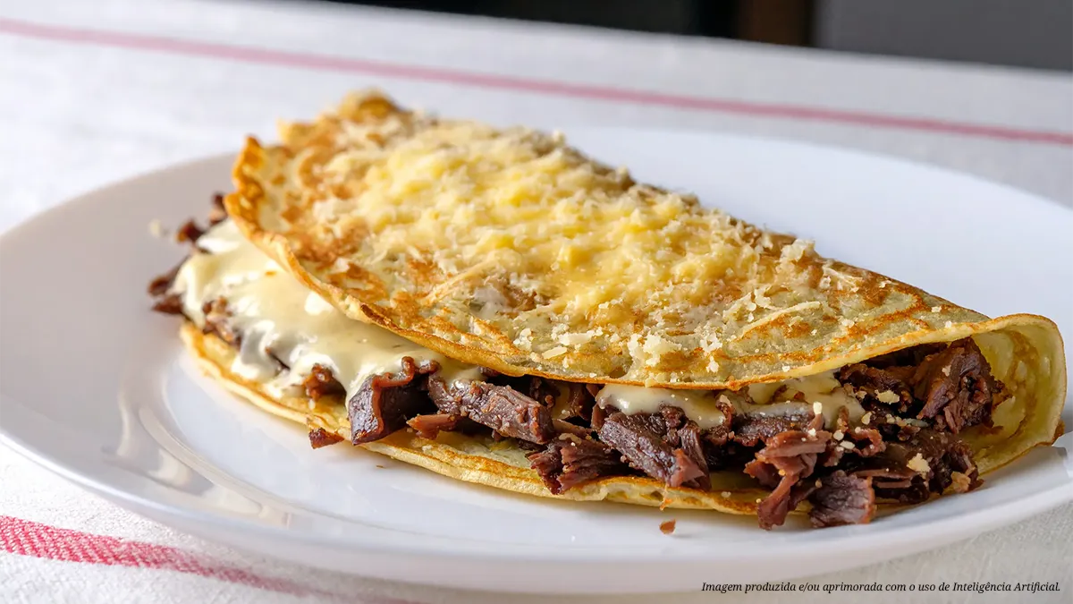 Panqueca de carne seca com molho branco e parmesão gratinado